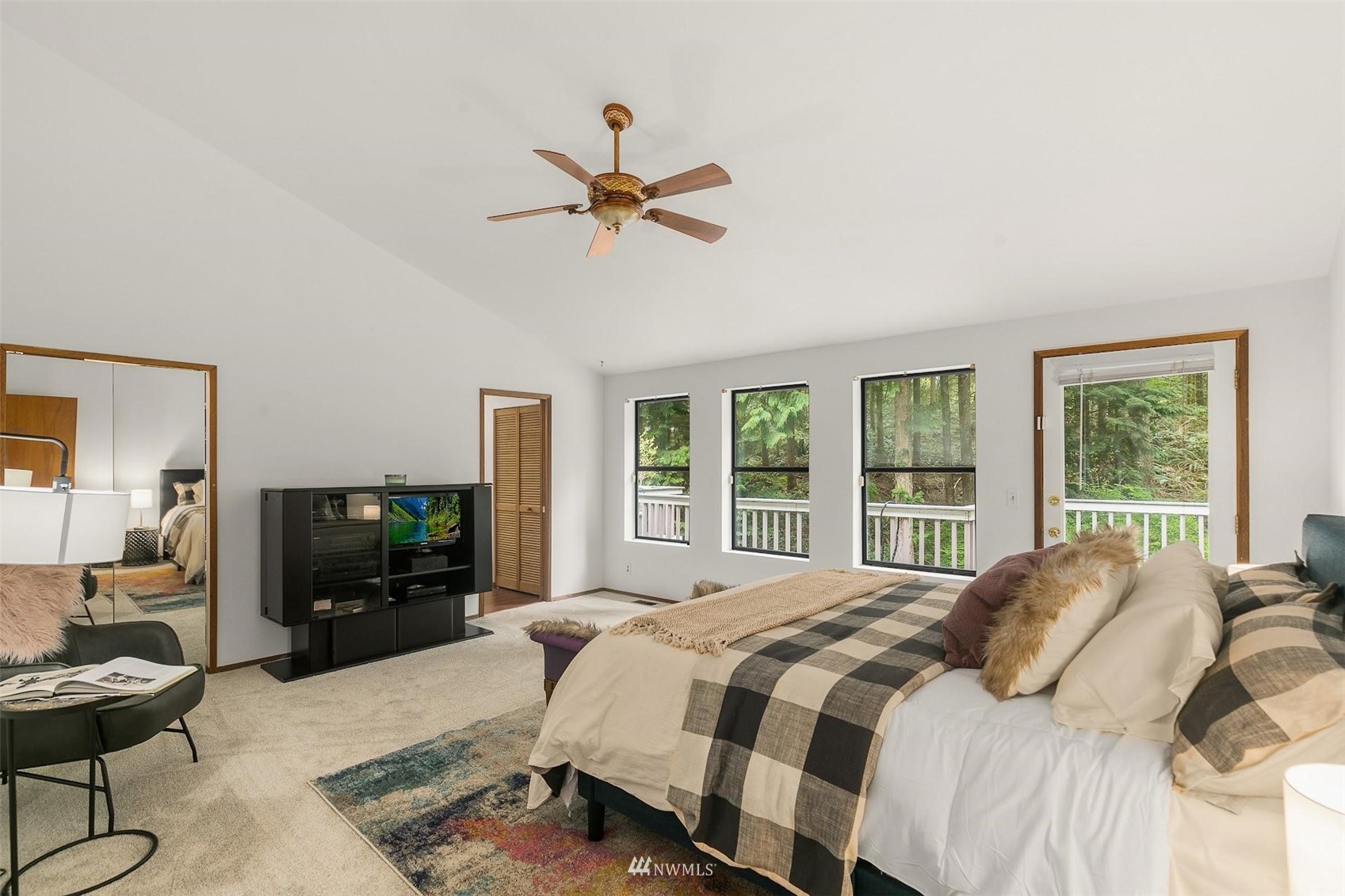 20712 29th Avenue Southeast Bothell, WA 98021 - Photo 11 of 40 a bedroom with a bed and a flat screen tv