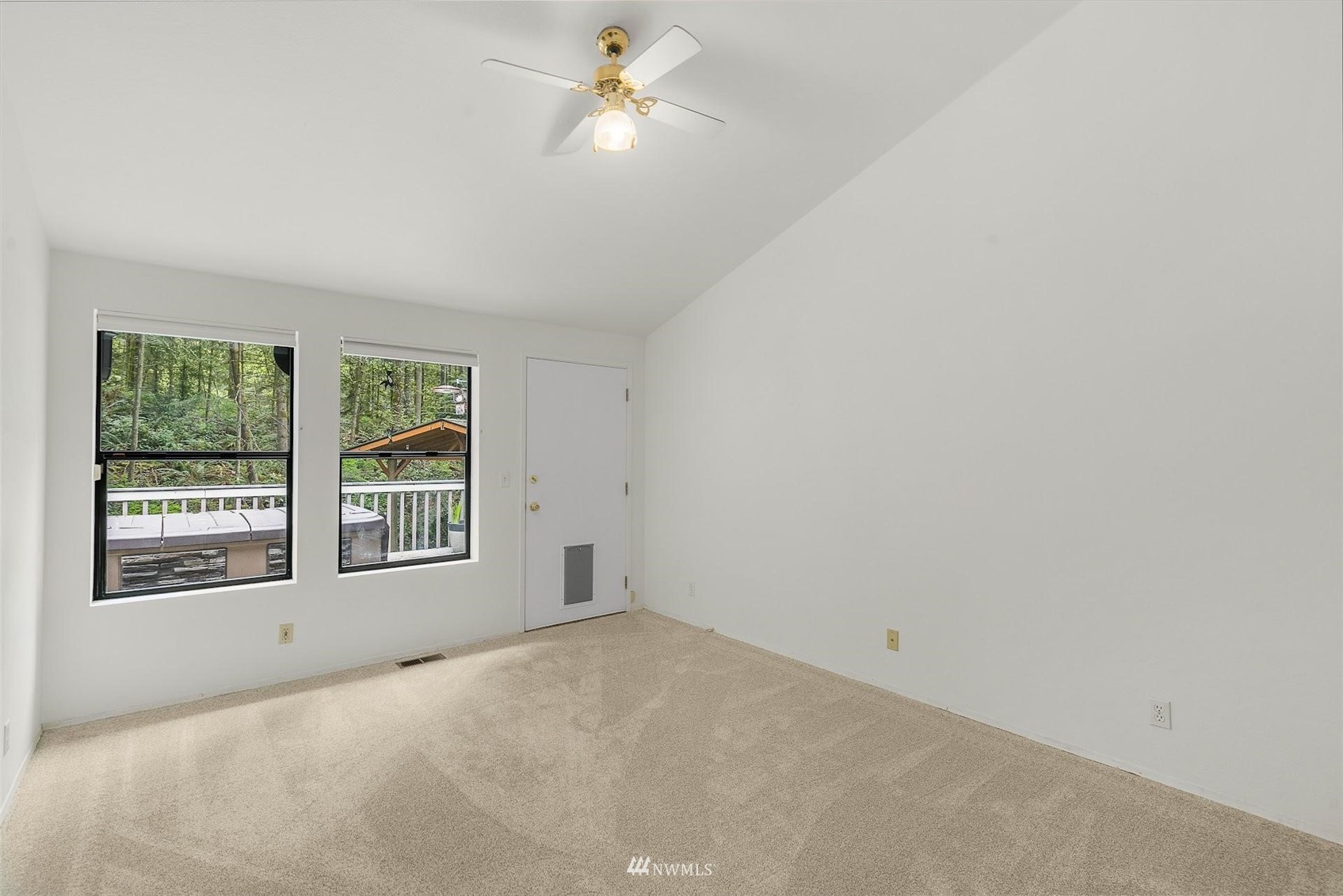 20712 29th Avenue Southeast Bothell, WA 98021 - Photo 16 of 40 an empty room with a window and a ceiling fan