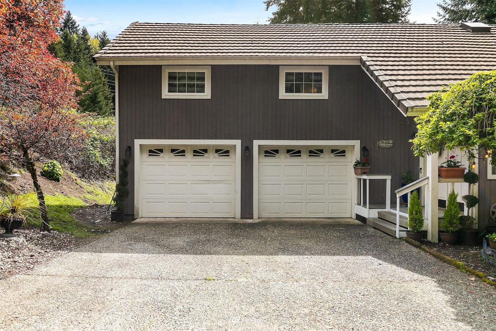 20712 29th Avenue Southeast Bothell, WA 98021 - Photo 2 of 40 a front view of a house with a garage