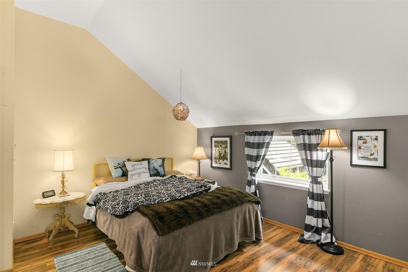 20712 29th Avenue Southeast Bothell, WA 98021 - Photo 21 of 40 a bedroom with a bed and wooden floor