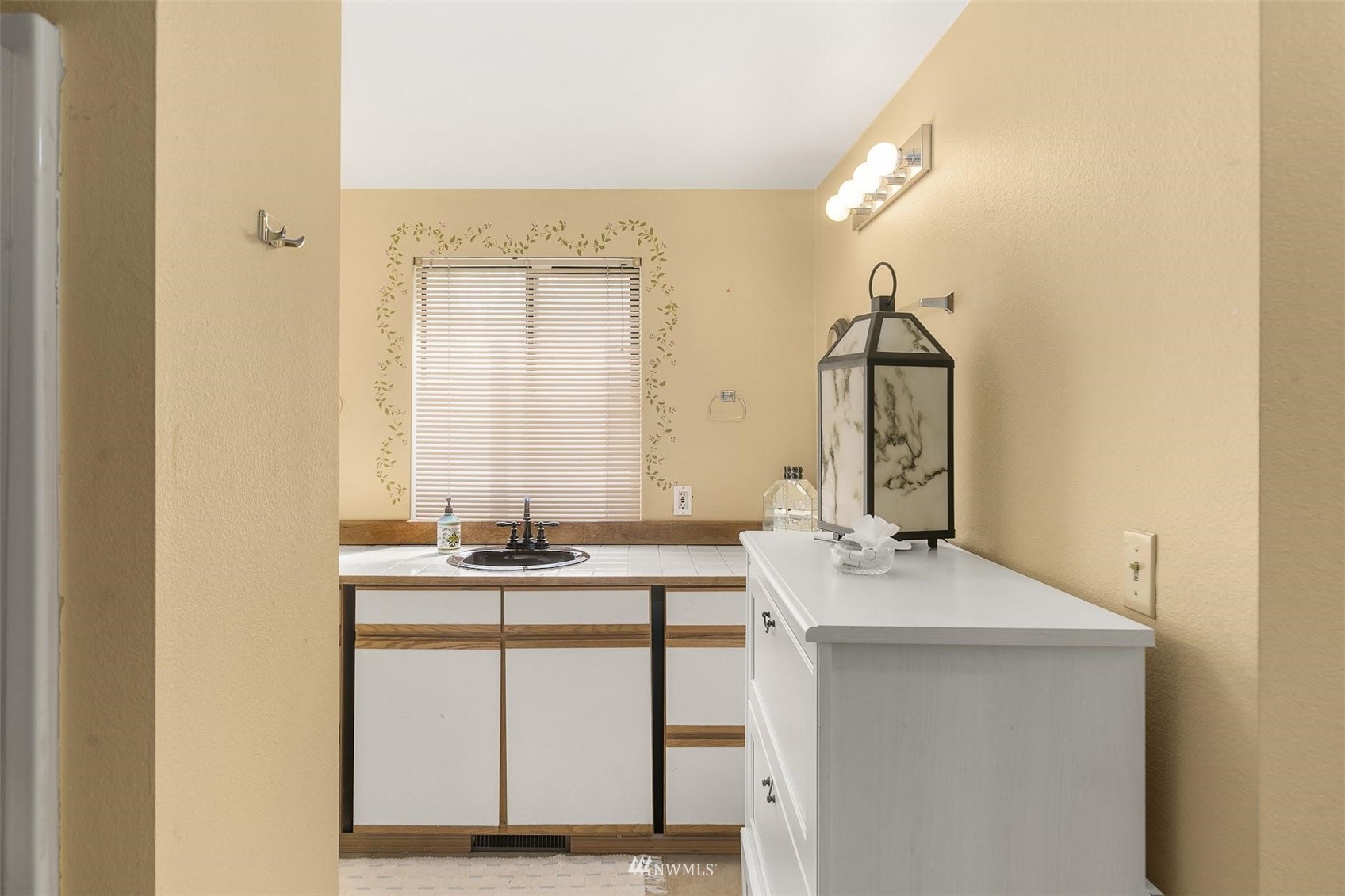 20712 29th Avenue Southeast Bothell, WA 98021 - Photo 24 of 40 a bathroom with a sink and a mirror