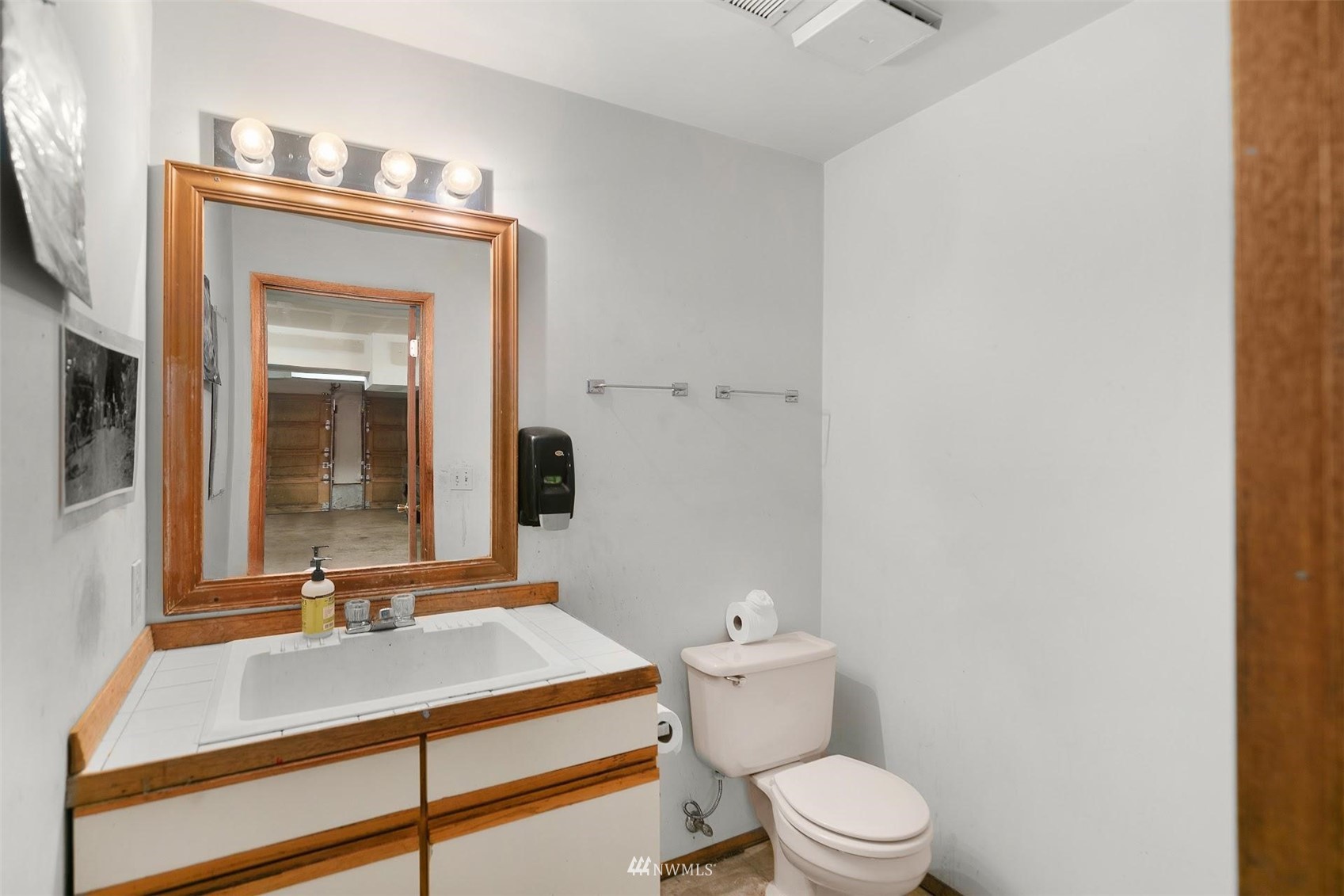 20712 29th Avenue Southeast Bothell, WA 98021 - Photo 30 of 40 a bathroom with a sink vanity mirror and toilet