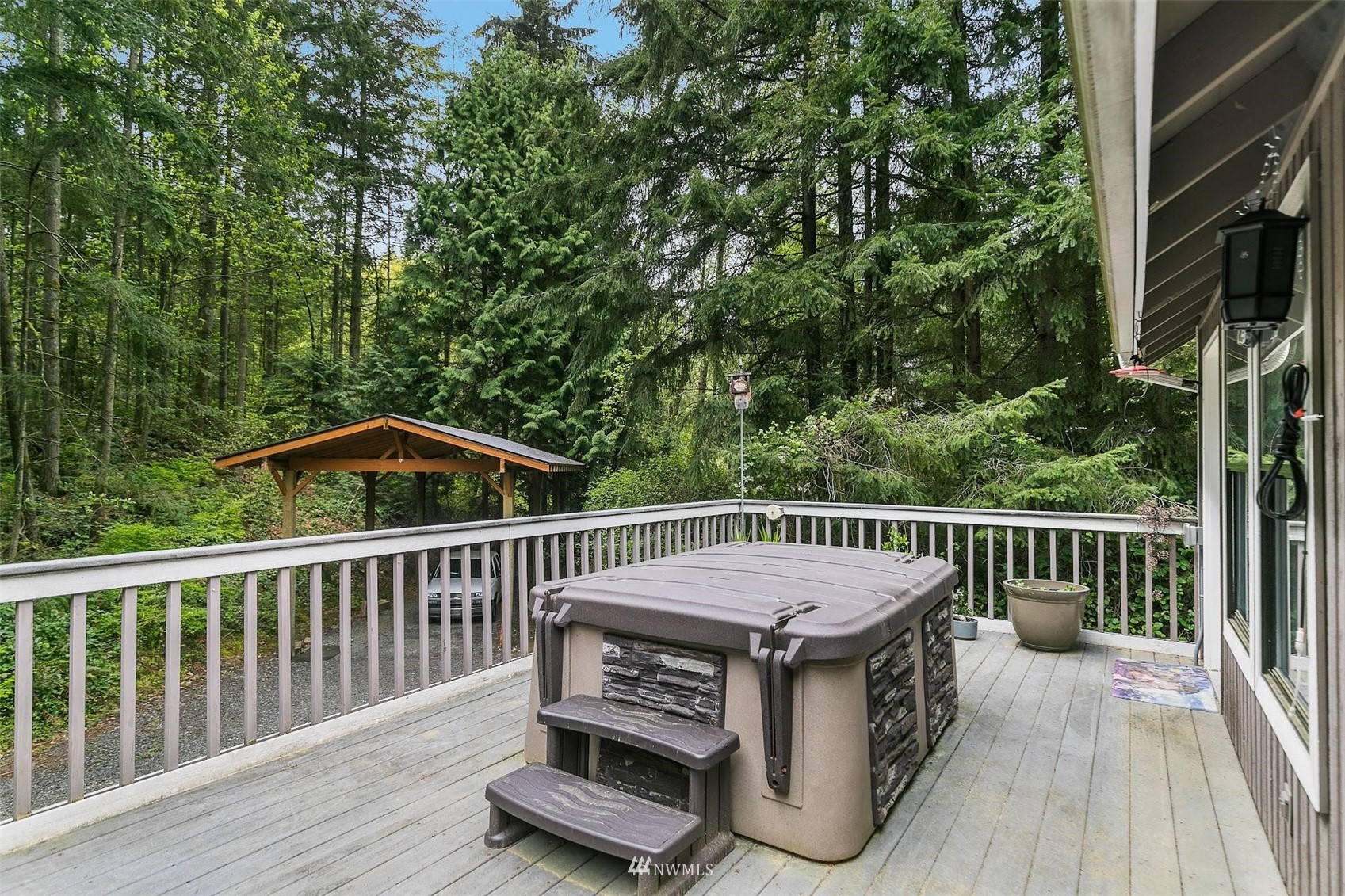 20712 29th Avenue Southeast Bothell, WA 98021 - Photo 33 of 40 a view of a roof deck with couches and wooden floor