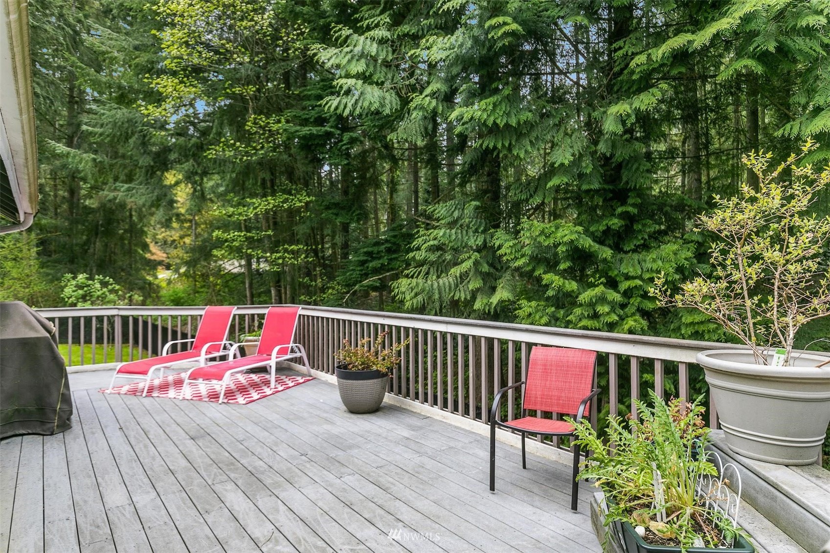 20712 29th Avenue Southeast Bothell, WA 98021 - Photo 34 of 40 a balcony with wooden floor and outdoor seating