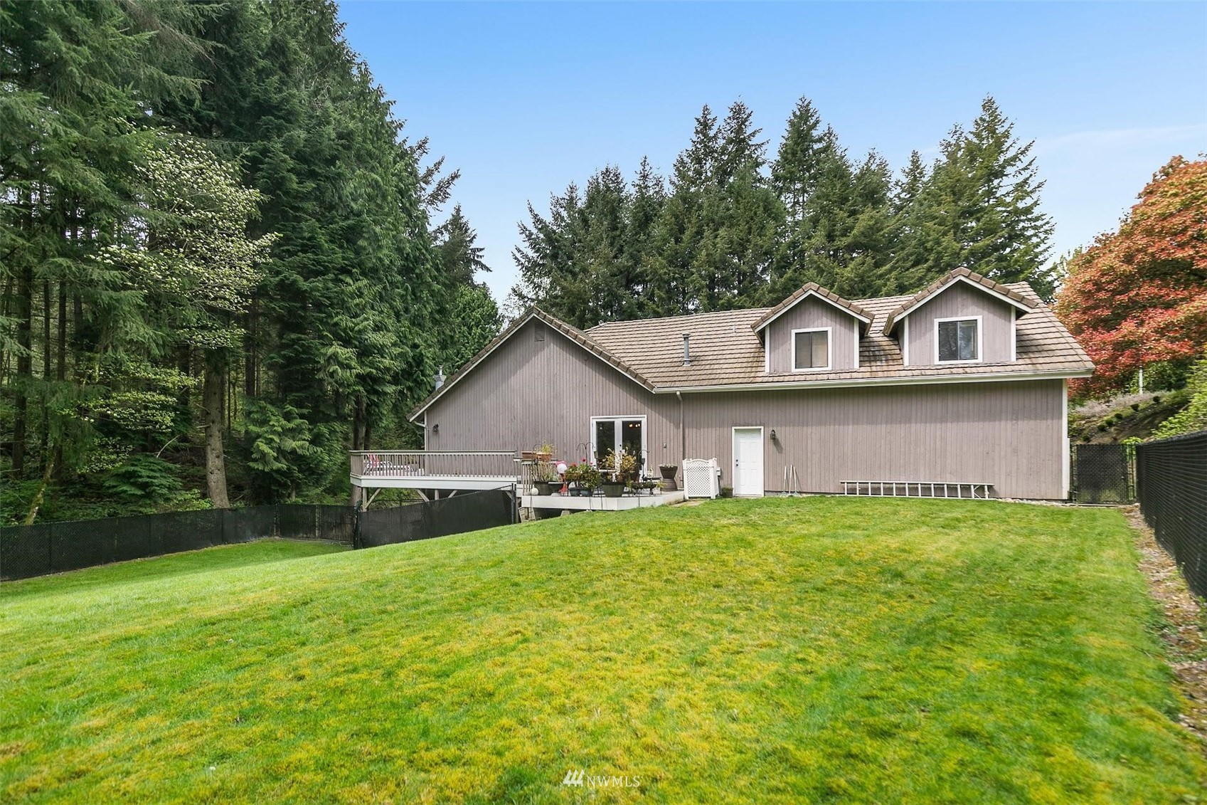 20712 29th Avenue Southeast Bothell, WA 98021 - Photo 36 of 40 a view of a house with a yard and large trees