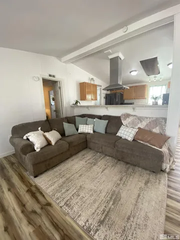 a living room with a bed and furniture