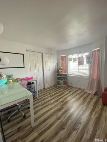 a bed room with a bed and a cabinets
