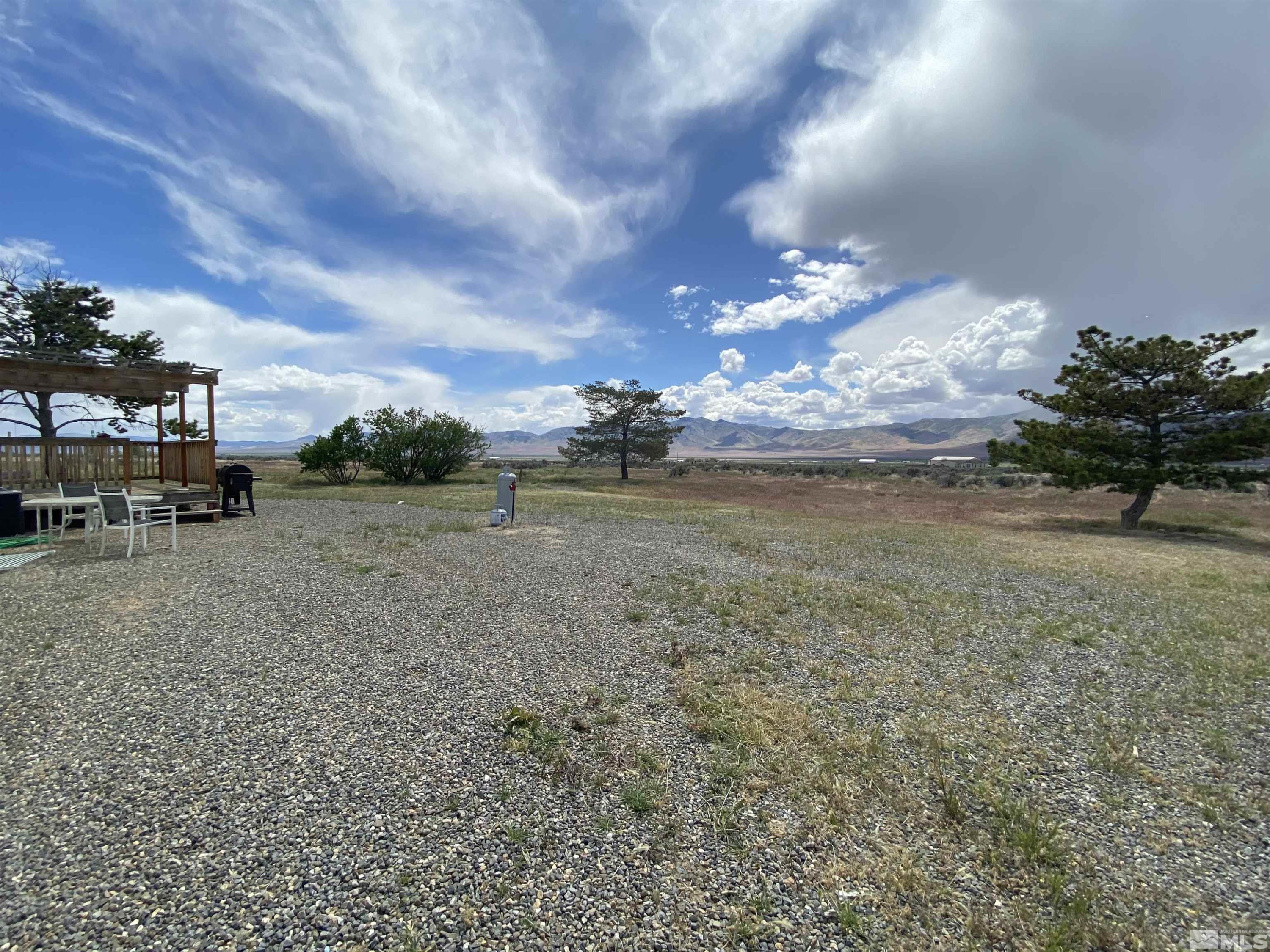 695 Good Choice Road Winnemucca, NV 89445 - Photo 17 of 29 a view of a lake with a big yard