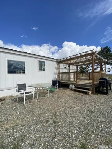 a view of a big yard of a house and an ocean view