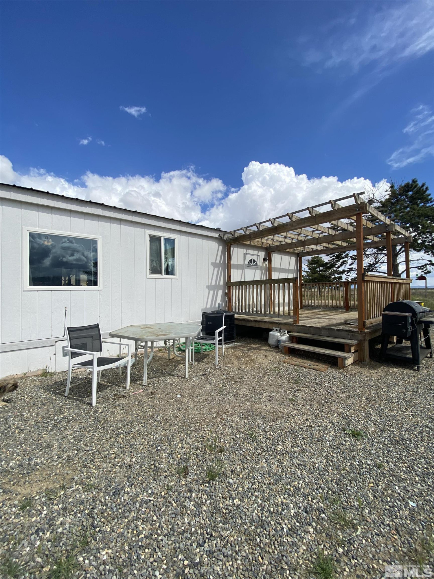 695 Good Choice Road Winnemucca, NV 89445 - Photo 18 of 29 a view of a house with backyard and sitting area