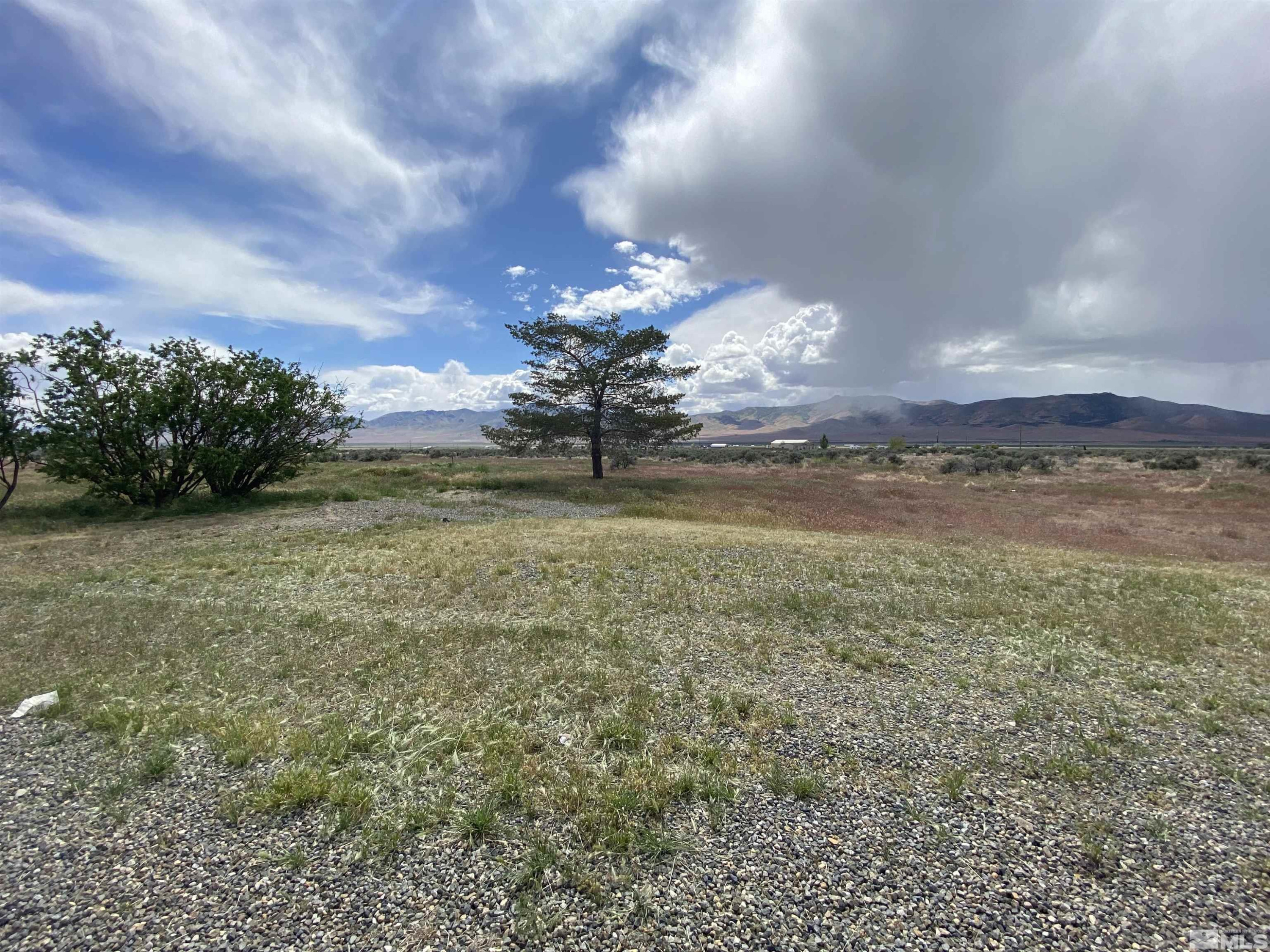 695 Good Choice Road Winnemucca, NV 89445 - Photo 19 of 29 a view of a big yard of a house and an ocean view