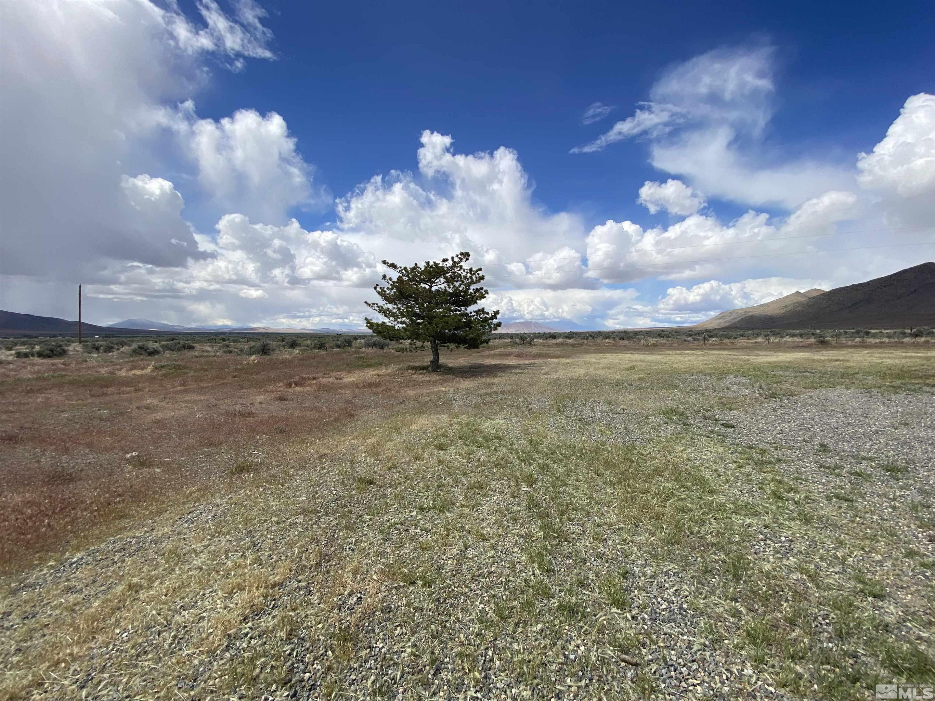695 Good Choice Road Winnemucca, NV 89445 - Photo 20 of 29 a view of a field with wooden fence