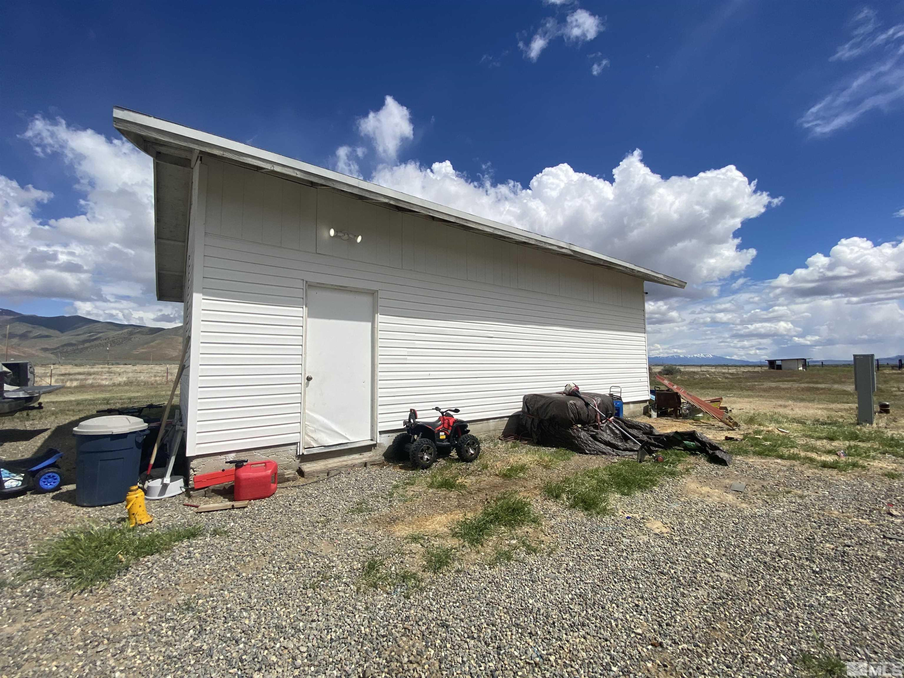 695 Good Choice Road Winnemucca, NV 89445 - Photo 23 of 29 a backyard of a house with table and chairs