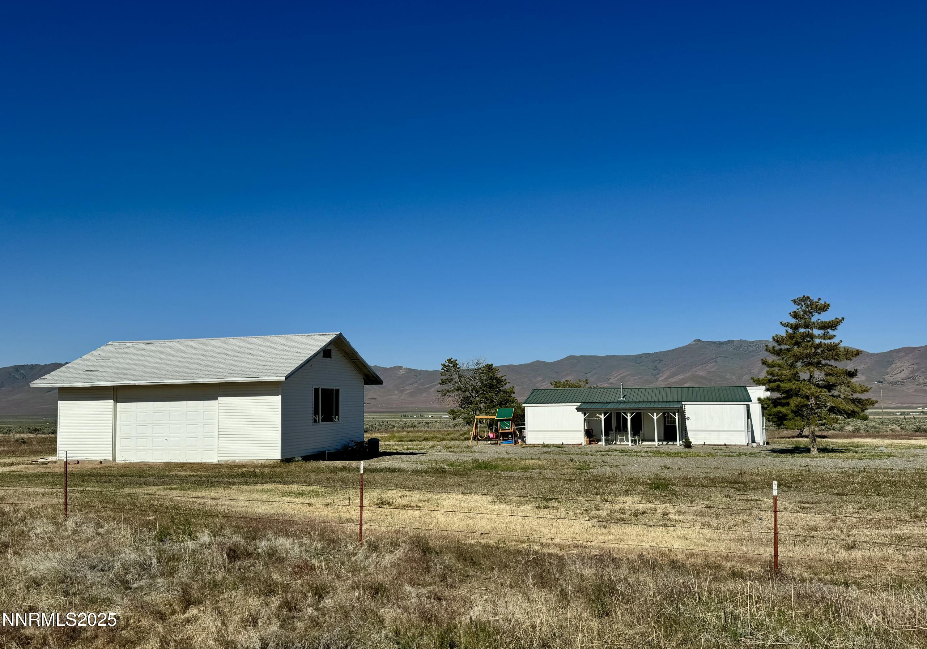 695 Good Choice Road Winnemucca, NV 89445 - Photo 28 of 29 a view of a house with a yard