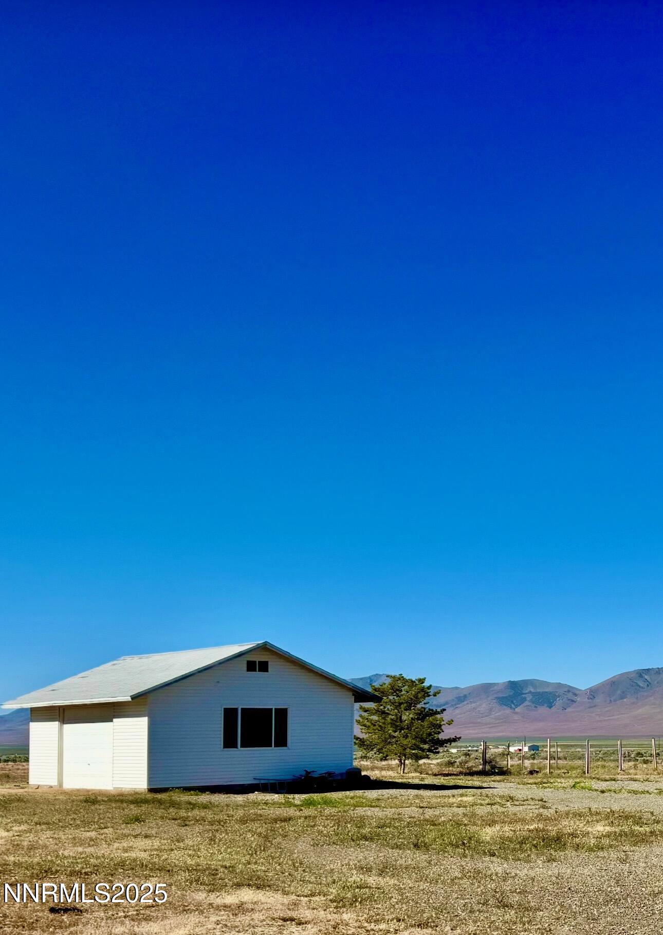 695 Good Choice Road Winnemucca, NV 89445 - Photo 29 of 29 a house with a field
