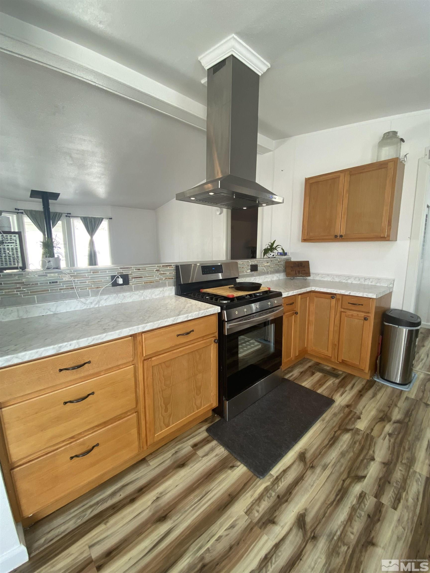 695 Good Choice Road Winnemucca, NV 89445 - Photo 6 of 29 a kitchen with stainless steel appliances granite countertop a sink stove and cabinets