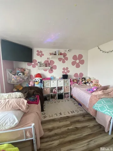 a bedroom with bed and window