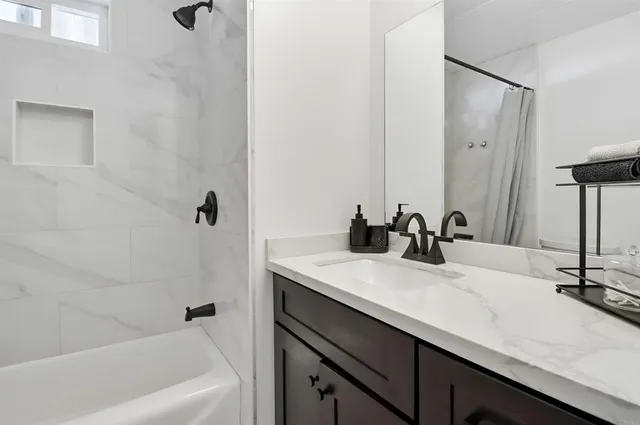 a bathroom with a sink and a bathtub