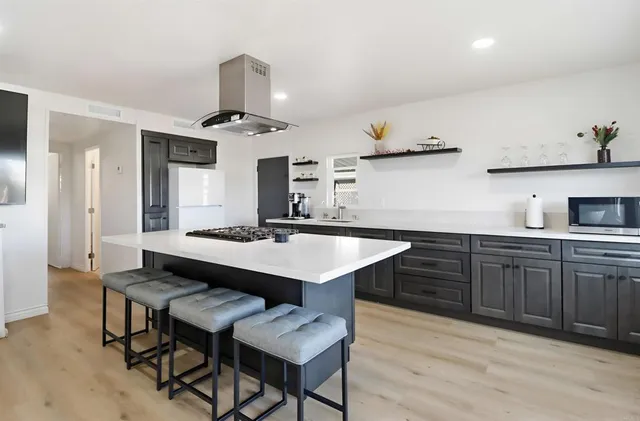 a kitchen with a table and chairs in it