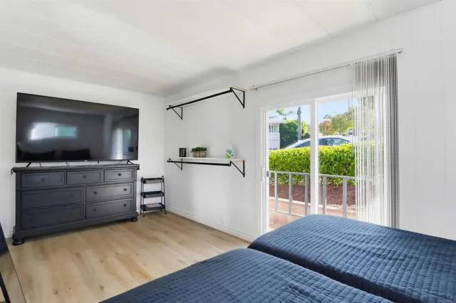 a room with furniture and flat screen tv