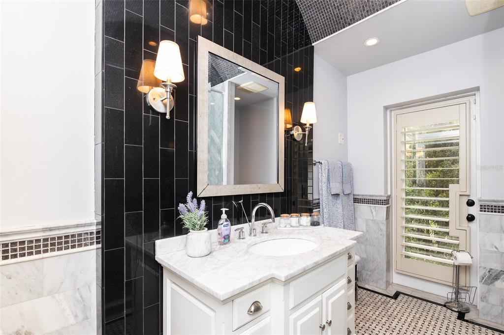1001 Nottingham Street Orlando, FL 32803 - Photo 33 of 49 a bathroom with a sink and a mirror