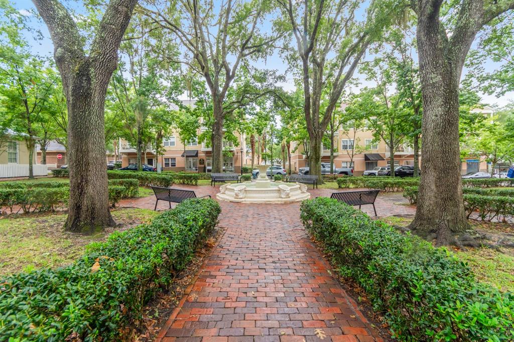 4850 Southwest 91 Terrace, Unit 301 Gainesville, FL 32608 - Photo 22 of 24 a walkway with trees on sides