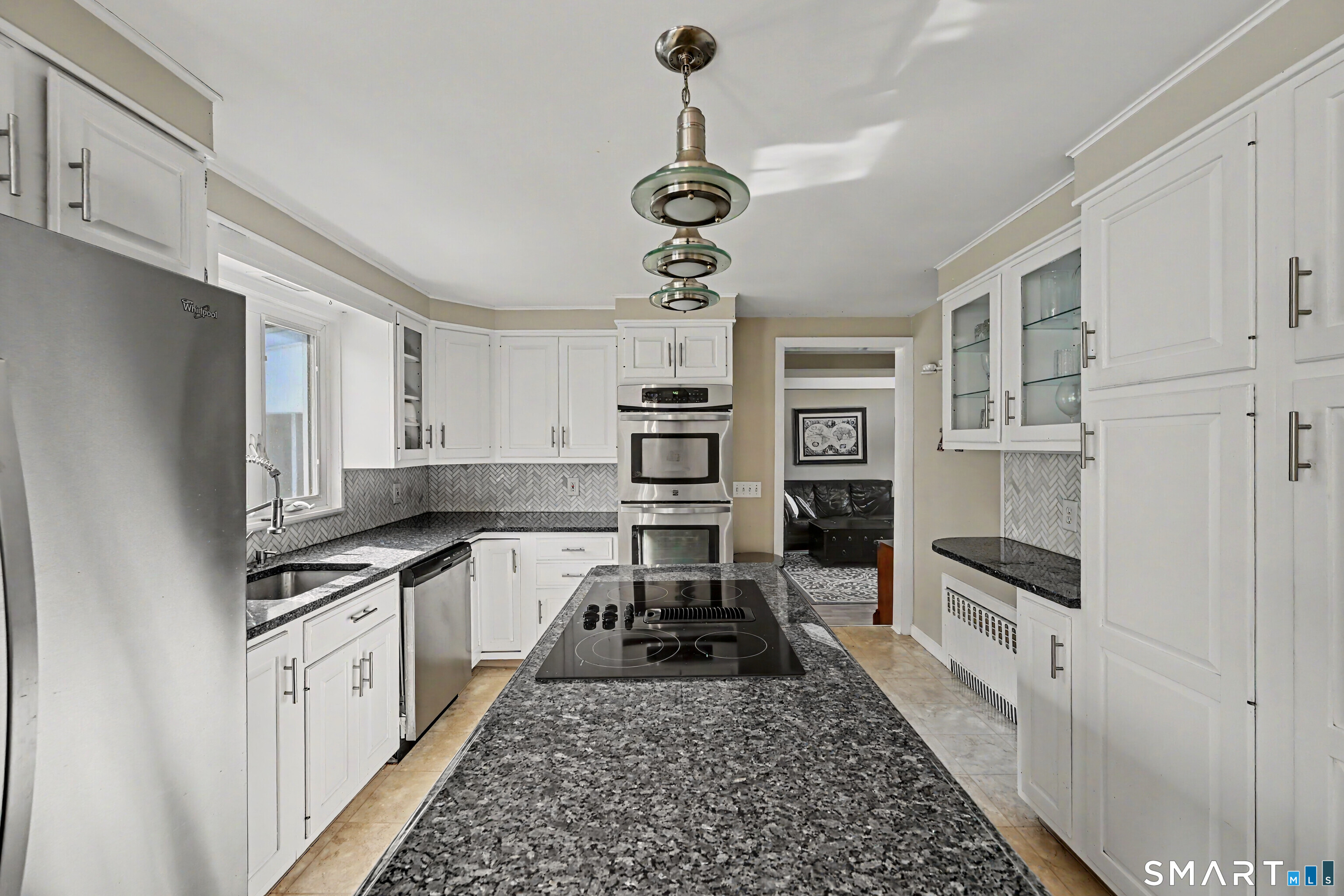 524 Ferry Road Orange, CT 06477 - Photo 11 of 40 a kitchen with stainless steel appliances granite countertop a stove and cabinets