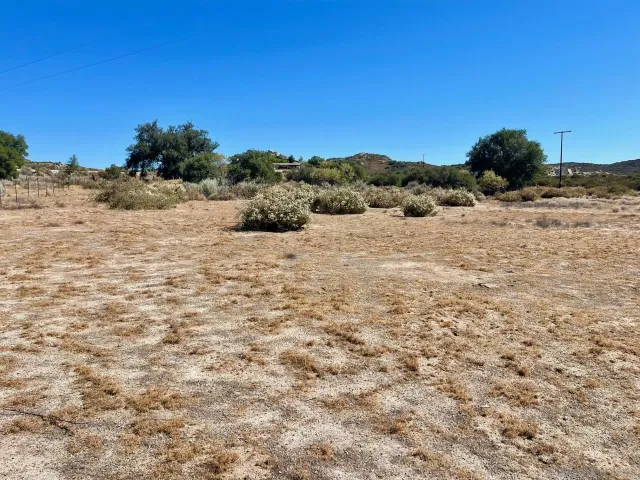 a view of a dinning table and chairs in the patio