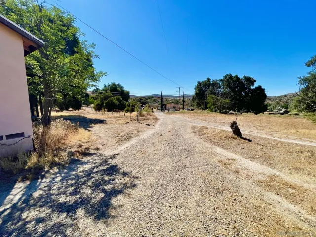 a view of a backyard of the house