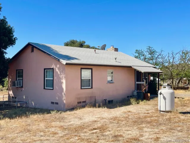 a backyard of a house with yard and garage