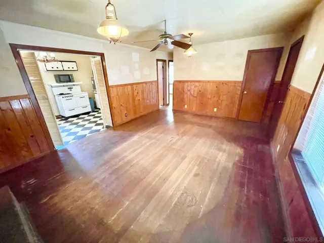 a view of a livingroom with wooden floor