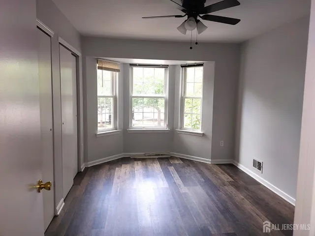 a bathroom with a toilet and a bathtub