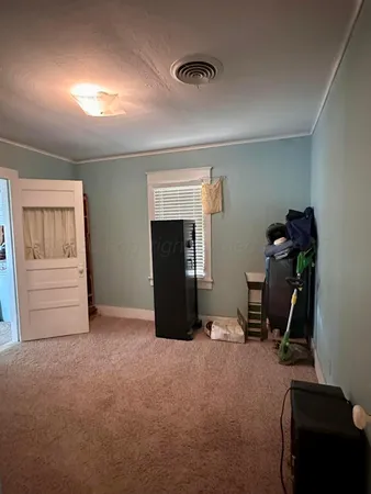 a kitchen with granite countertop a sink and cabinets