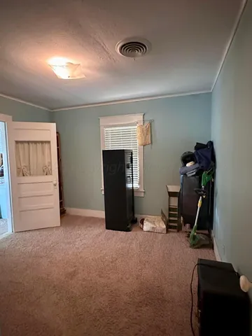 a kitchen with granite countertop a sink and cabinets