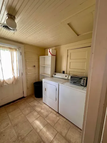 a view of porch with furniture and a window