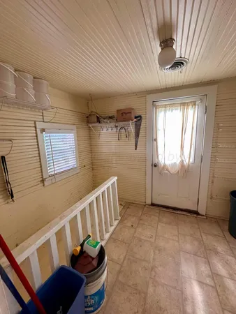 a bedroom with bed and a window