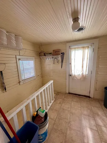 a bedroom with bed and a window