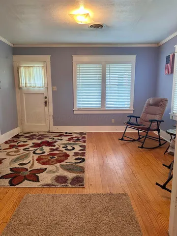 a bed room with a bed and a chair