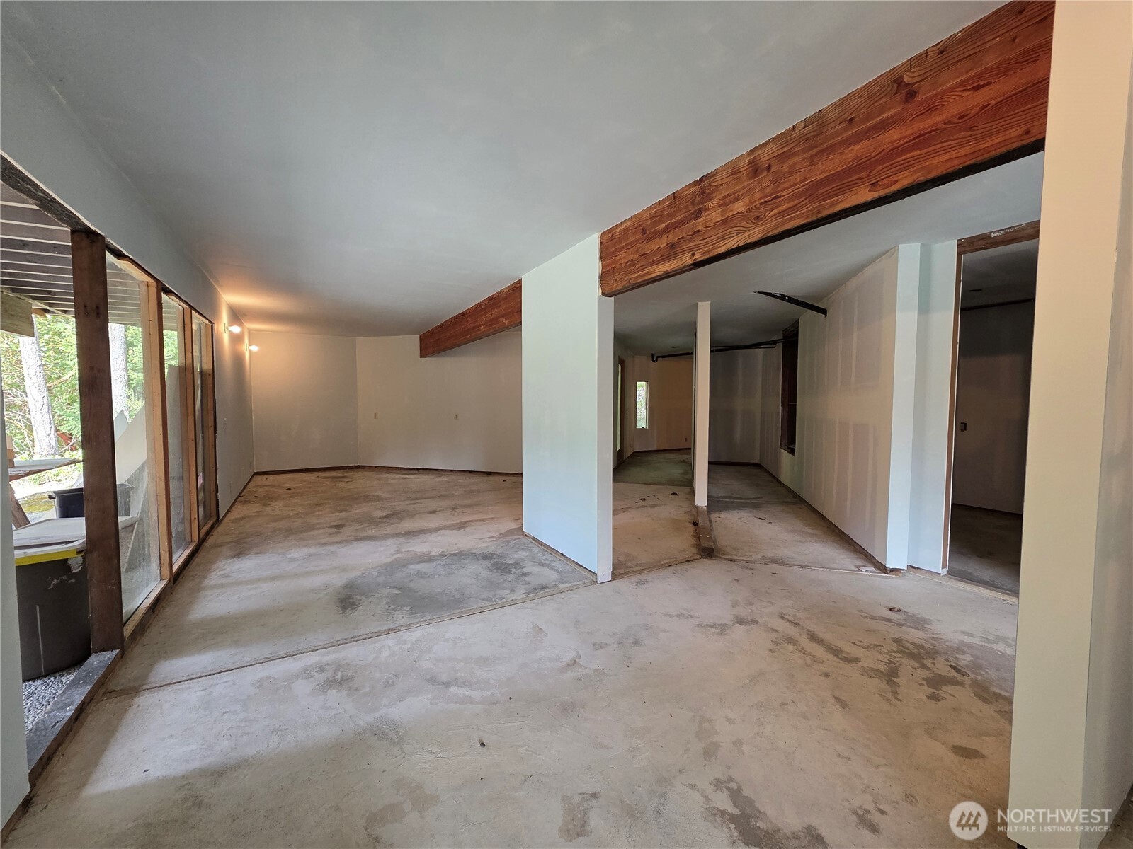 5612 Cape George Road Port Townsend, WA 98368 - Photo 15 of 17 a view of a hallway with wooden shelves and windows