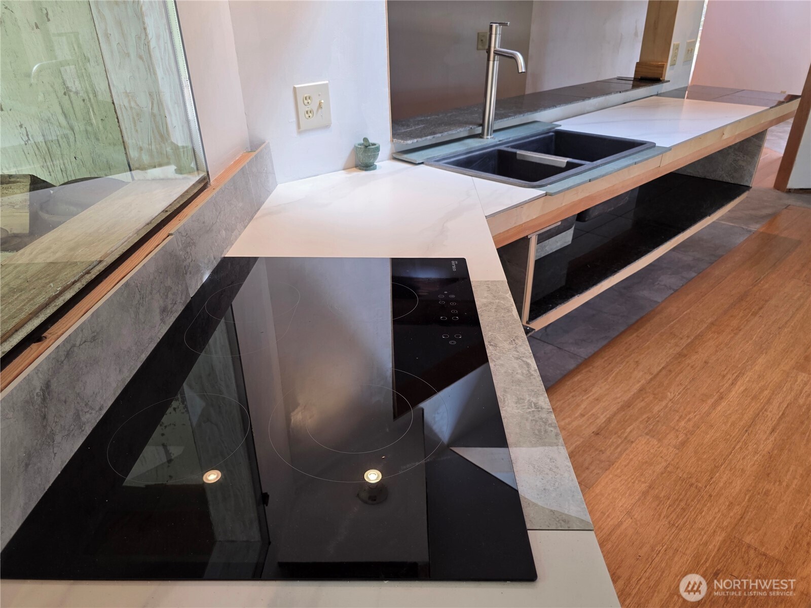 5612 Cape George Road Port Townsend, WA 98368 - Photo 8 of 17 a kitchen with a sink and white cabinets