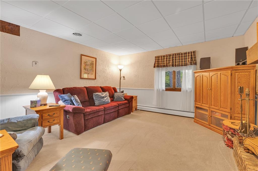 124 Heath Drive Baden, PA 15005 - Photo 11 of 38 a living room with furniture a lamp and a window