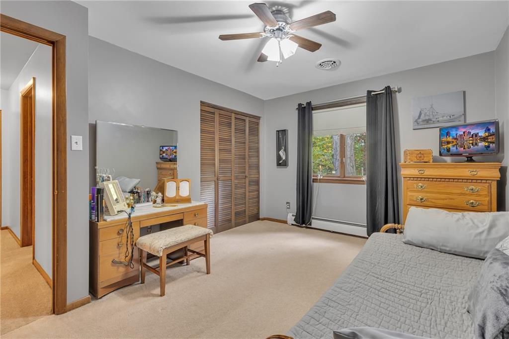 124 Heath Drive Baden, PA 15005 - Photo 18 of 38 a bedroom with a bed and a chandelier