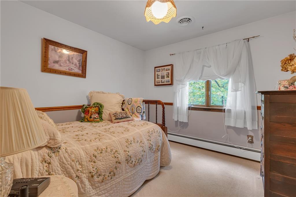 124 Heath Drive Baden, PA 15005 - Photo 19 of 38 a bedroom with a bed and a window