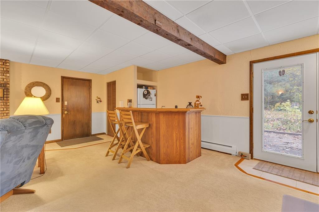 124 Heath Drive Baden, PA 15005 - Photo 22 of 38 a view of a livingroom with furniture and garage