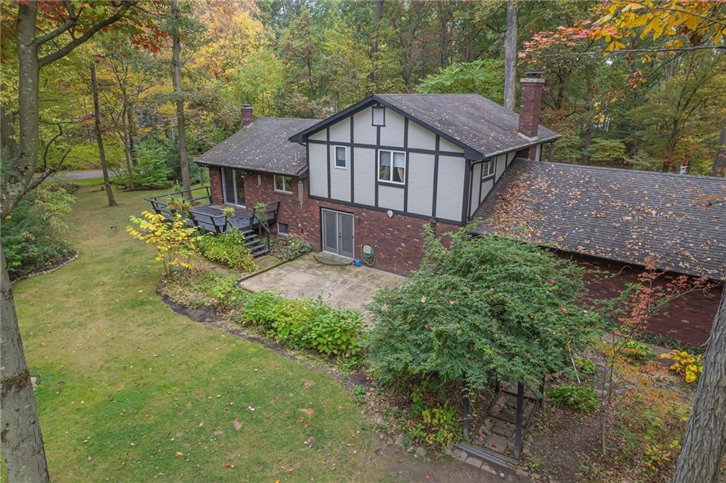124 Heath Drive Baden, PA 15005 - Photo 36 of 38 a view of a house with a yard and large trees