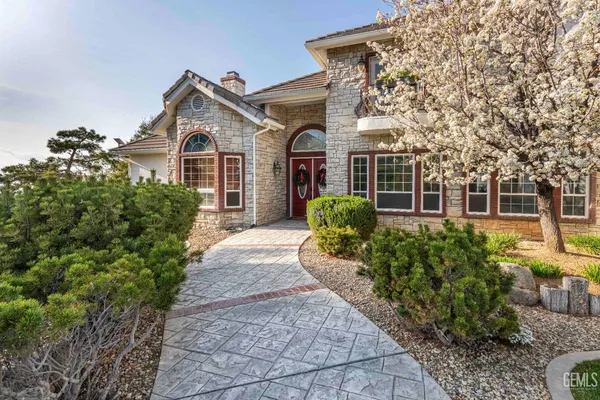 a view of a white house with a yard