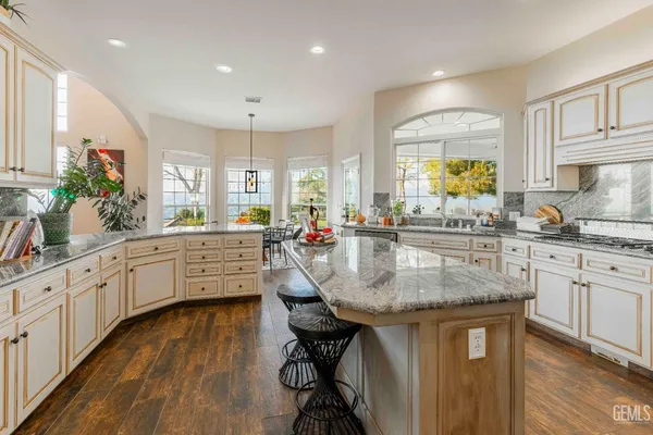 a kitchen with lots of counter top space and dining table
