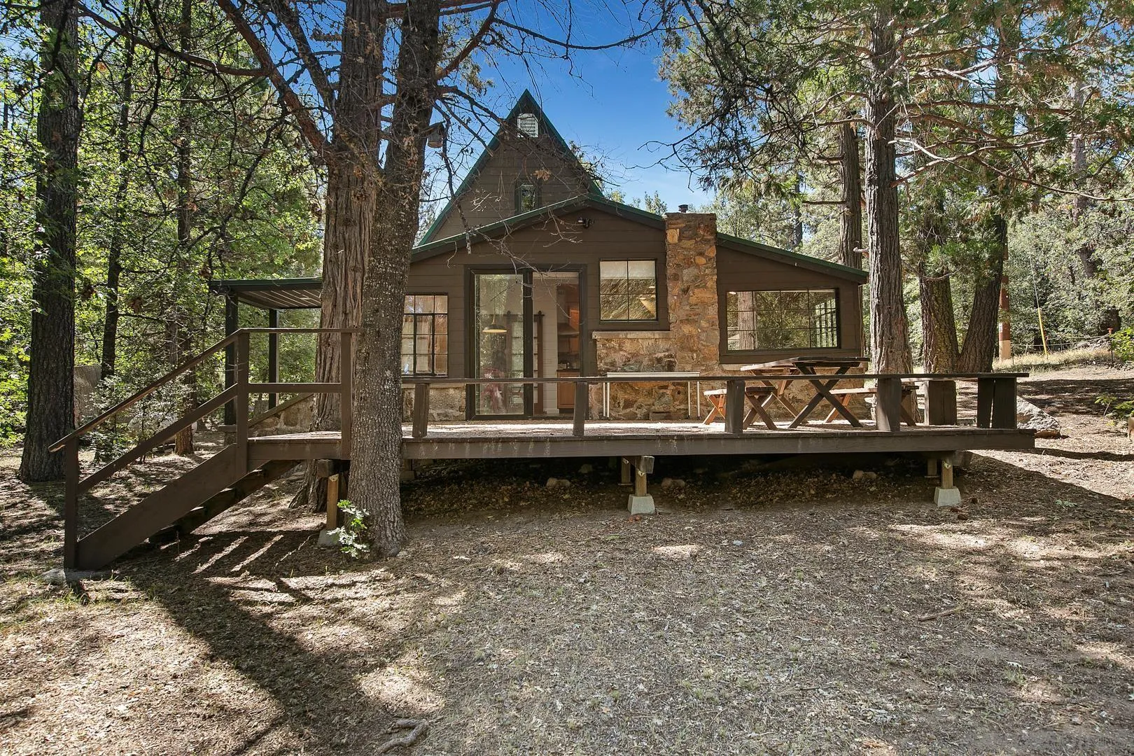a view of a house with a yard covered in snow