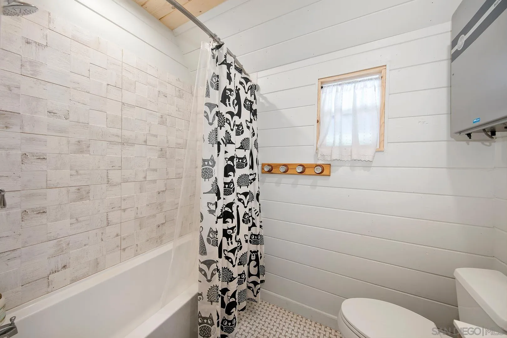 326 Laguna Tract Road Pine Valley, CA 91962 - Photo 22 of 29 a bathroom with a toilet and a shower curtain