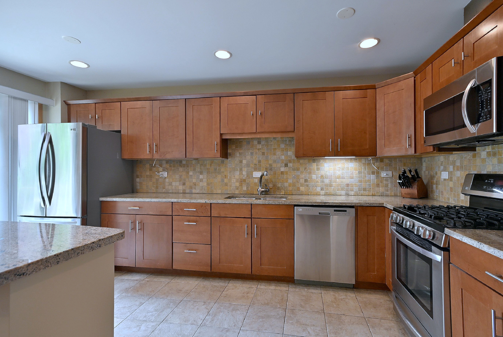 2350 North Sayre Avenue, Unit G Chicago, IL 60707 - Photo 9 of 30 a kitchen with granite countertop cabinets stainless steel appliances a sink and a counter top space